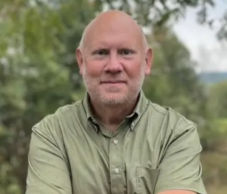 John Fowler — a warm outdoor portrait, the kind of person who'd sit across the table from you.